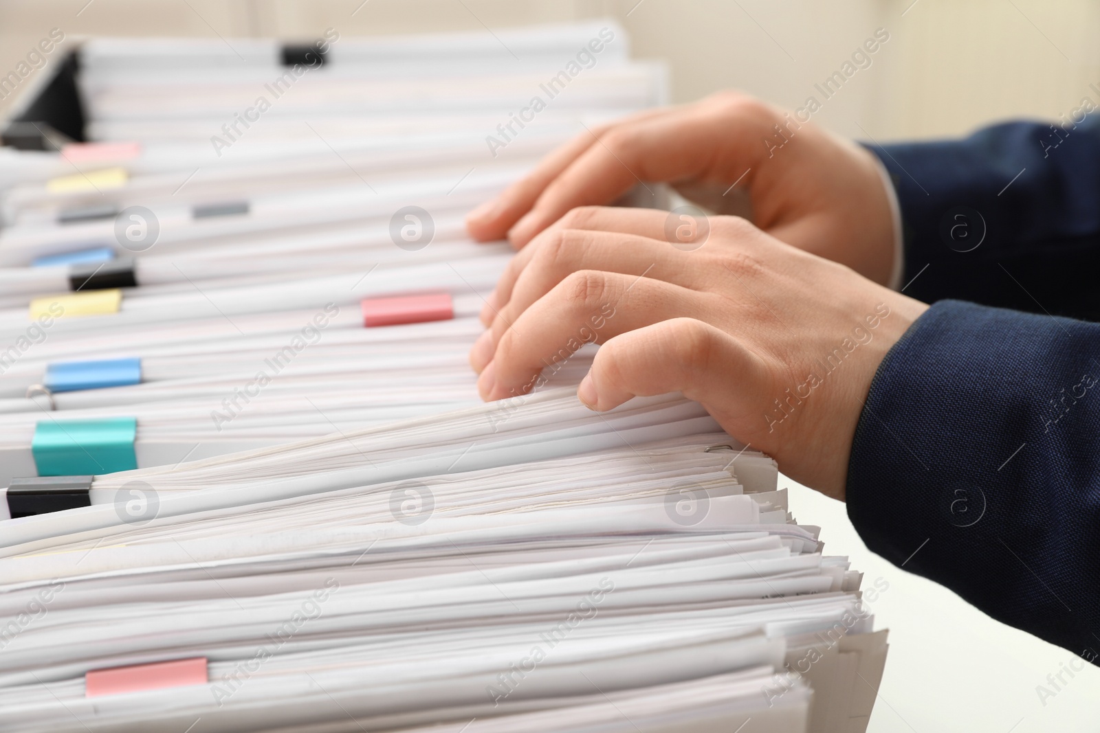 Photo of Woman working with documents in office, closeup