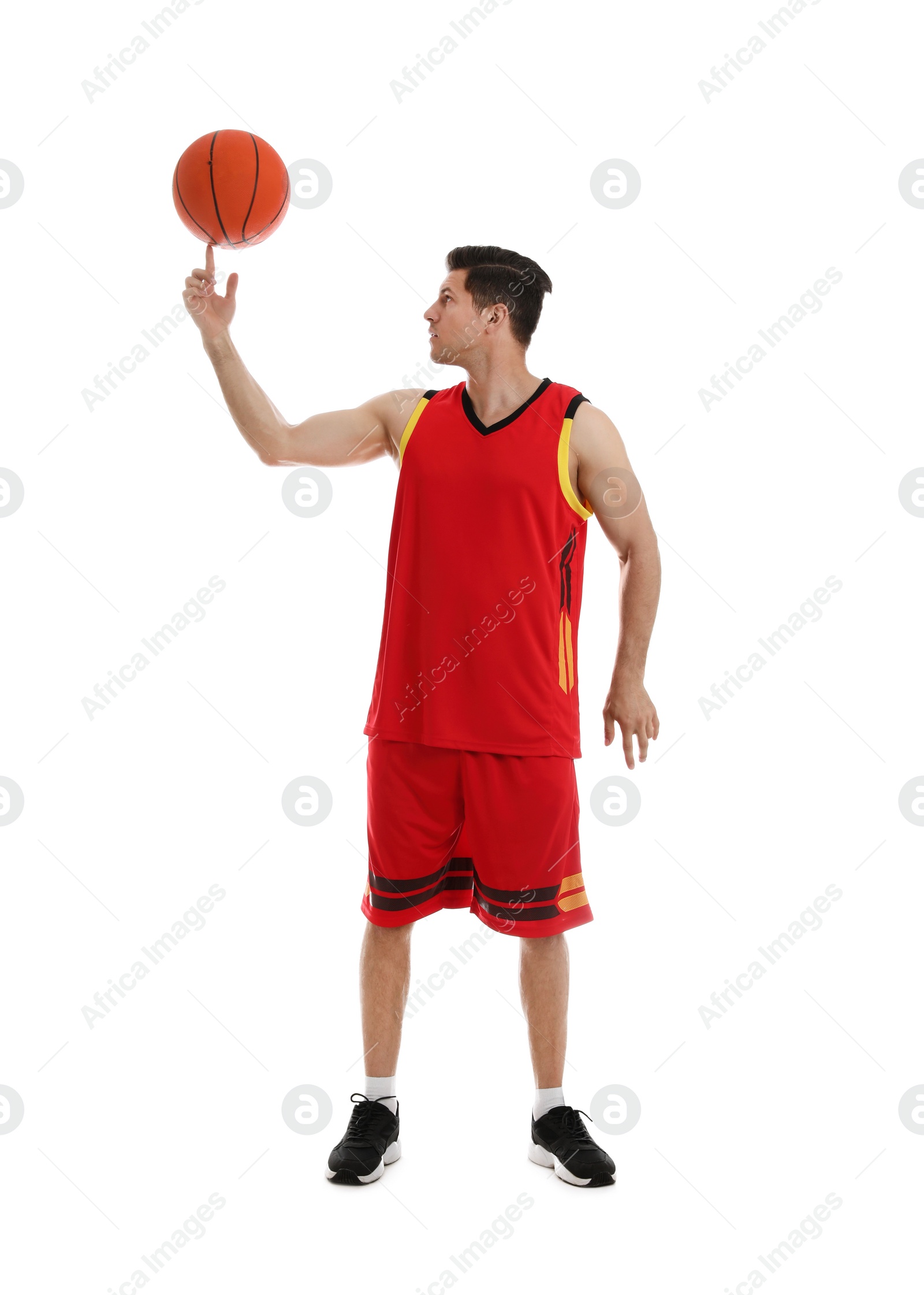 Photo of Basketball player spinning ball on finger against white background