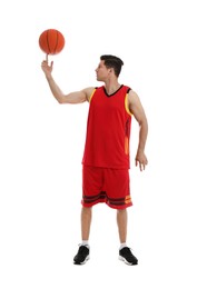 Basketball player spinning ball on finger against white background
