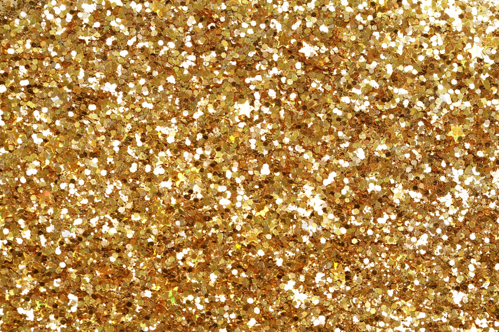 Photo of Beautiful golden shiny glitter as background, top view