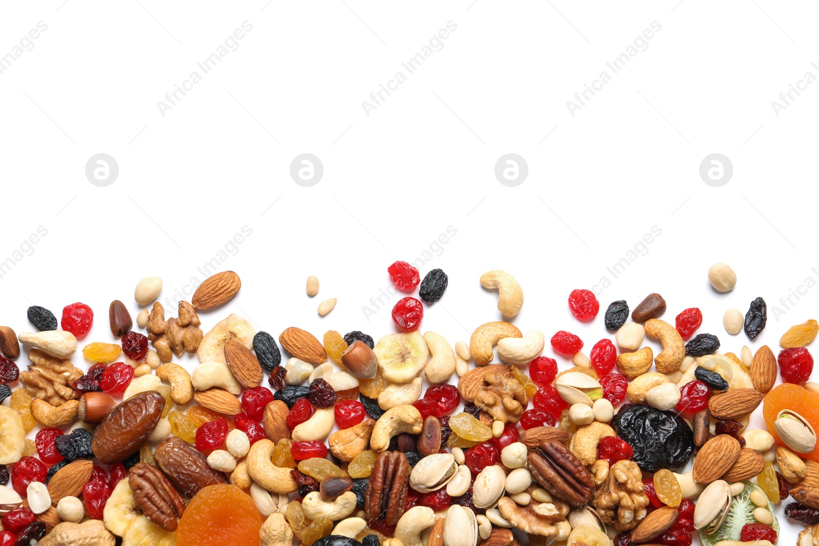 Photo of Different dried fruits and nuts on white background, top view. Space for text