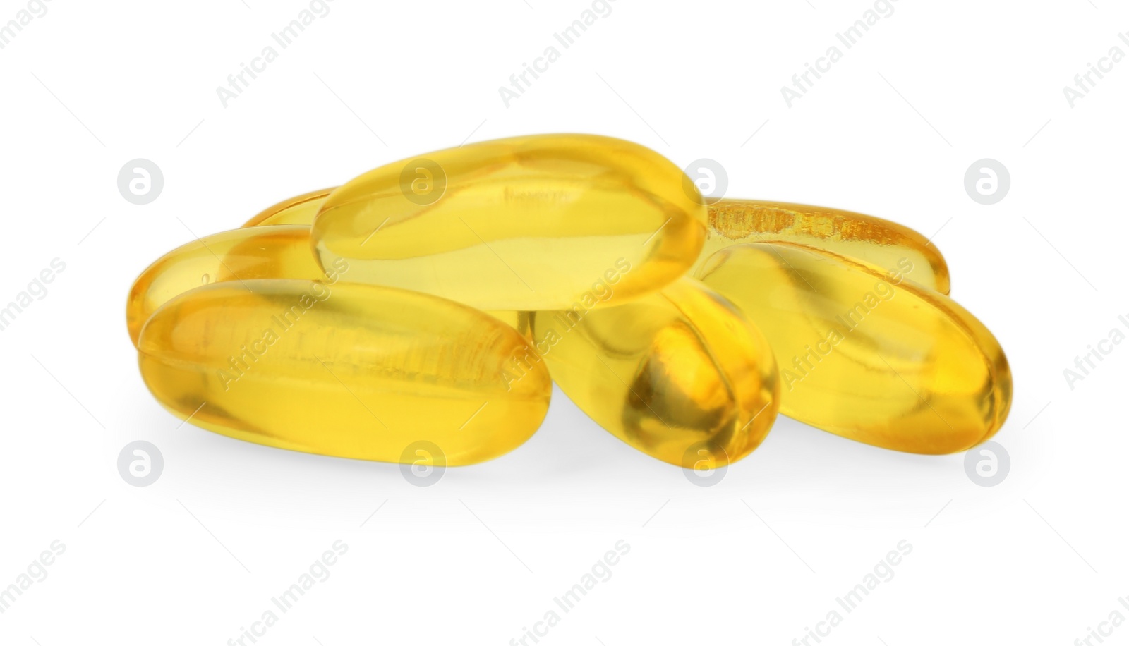 Photo of Many yellow vitamin capsules isolated on white