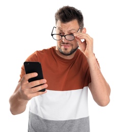 Man with vision problems using smartphone on white background