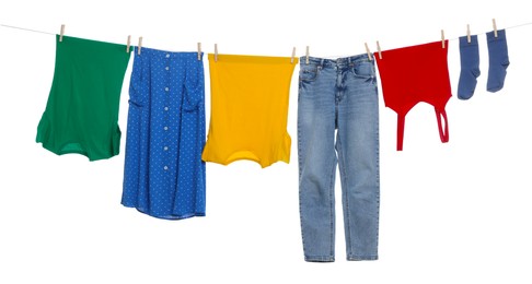 Photo of Different clothes drying on laundry line against white background