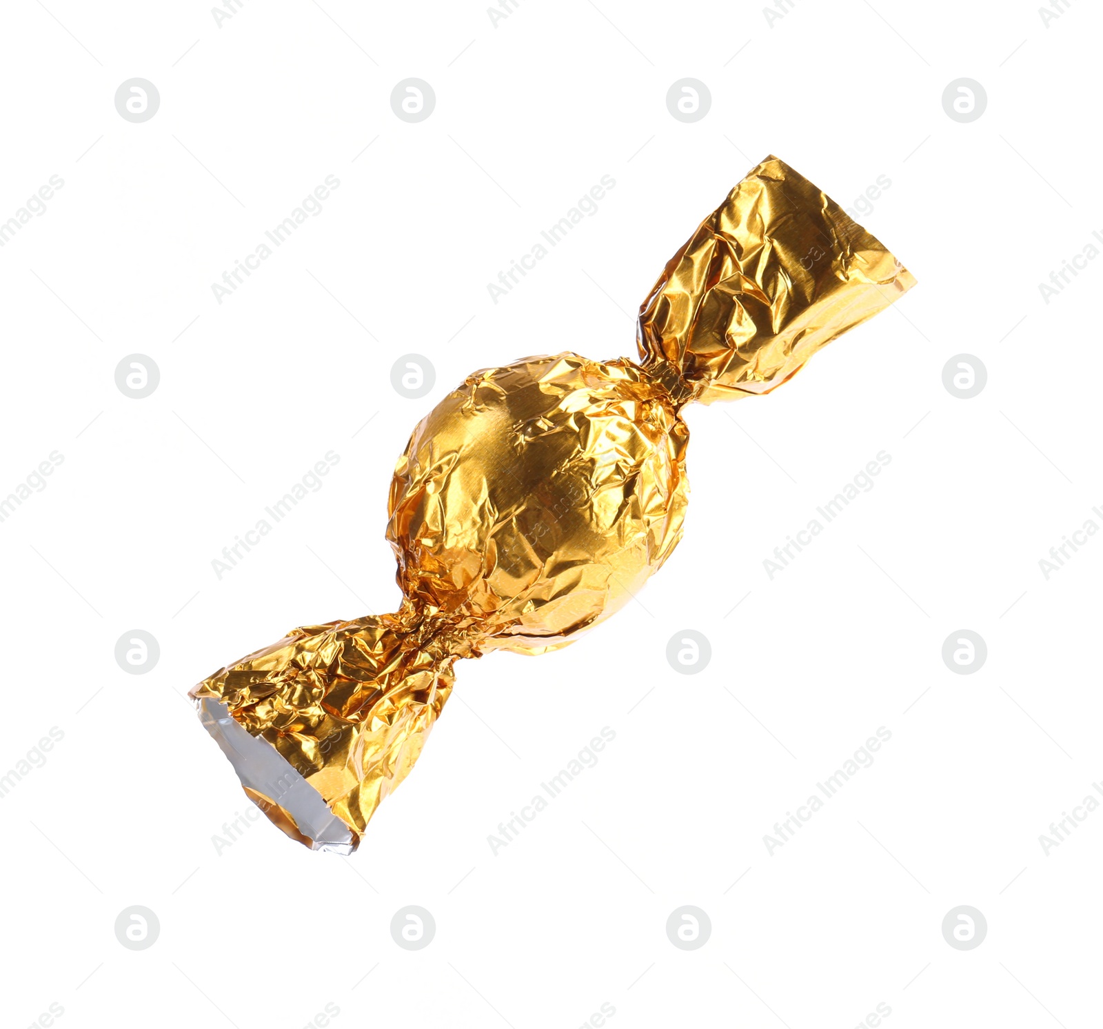 Photo of Tasty candy in yellow wrapper isolated on white