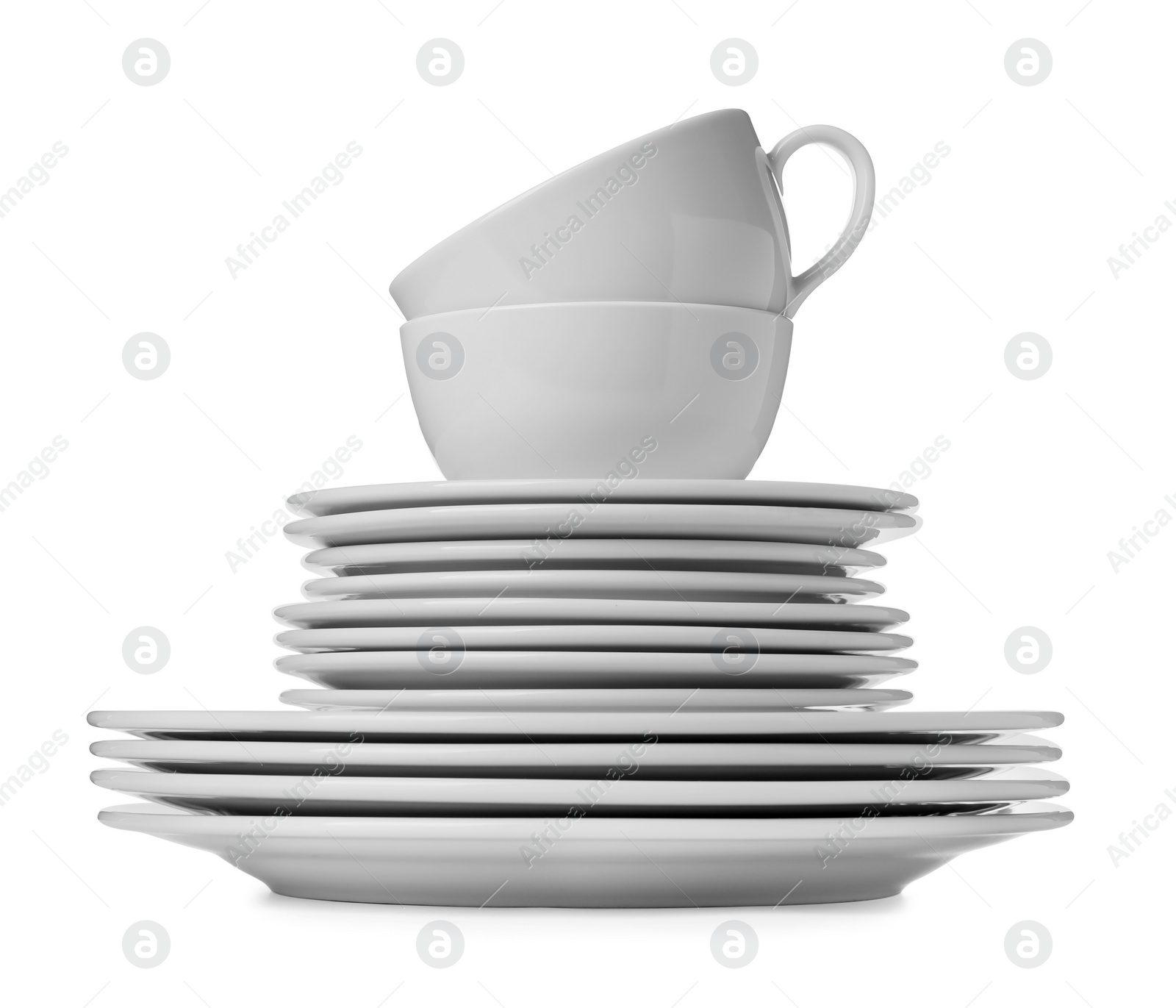 Photo of Set of clean dishware isolated on white