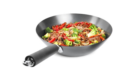 Photo of Stir-fry. Tasty noodles with meat and vegetables in wok isolated on white