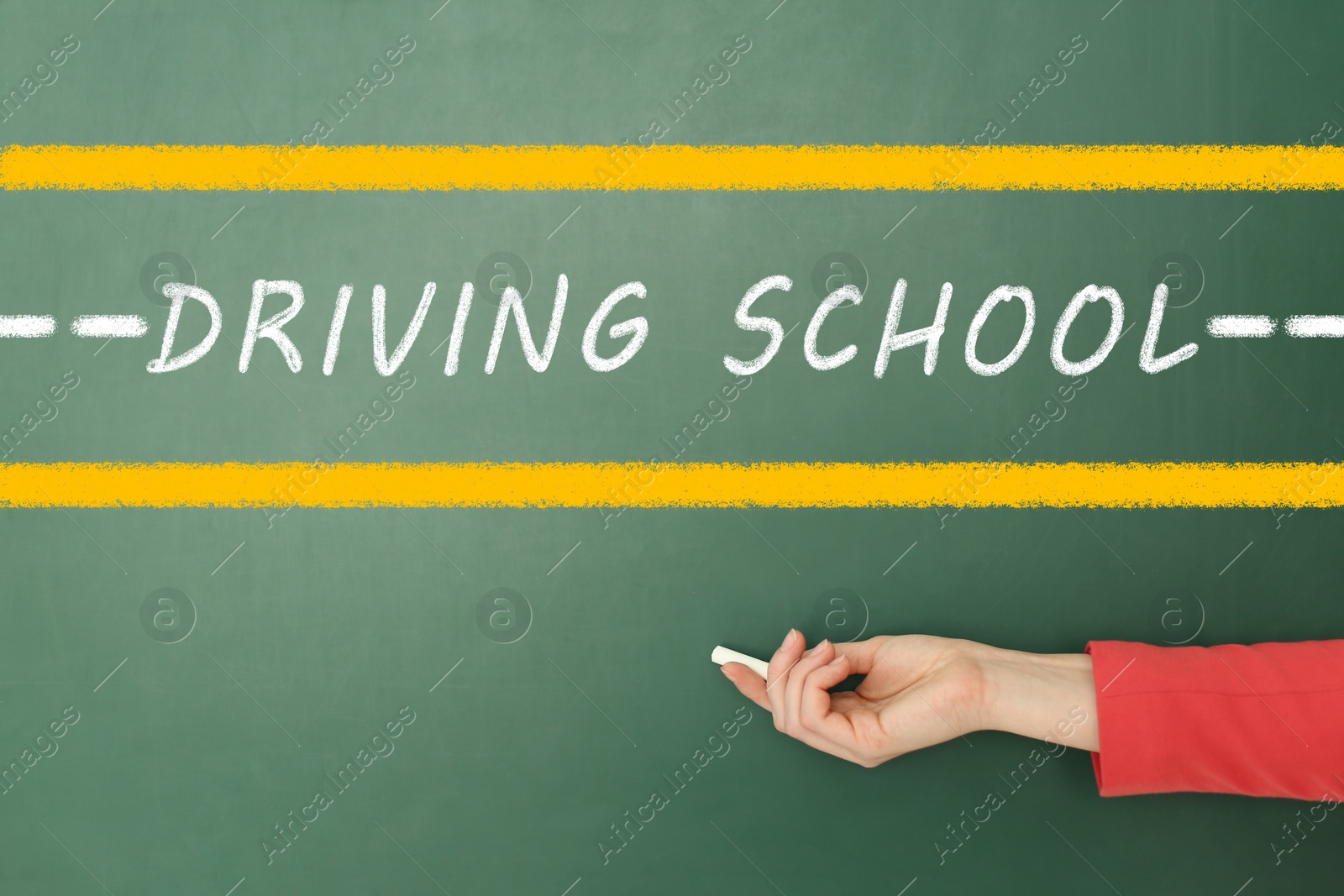 Image of  Driving school concept. Woman with white chalk near green board, closeup