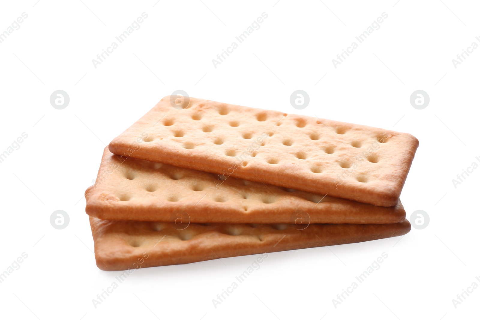 Photo of Crispy crackers isolated on white. Delicious snack