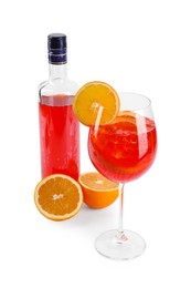 Bottle and glass of tasty Aperol spritz cocktail isolated on white