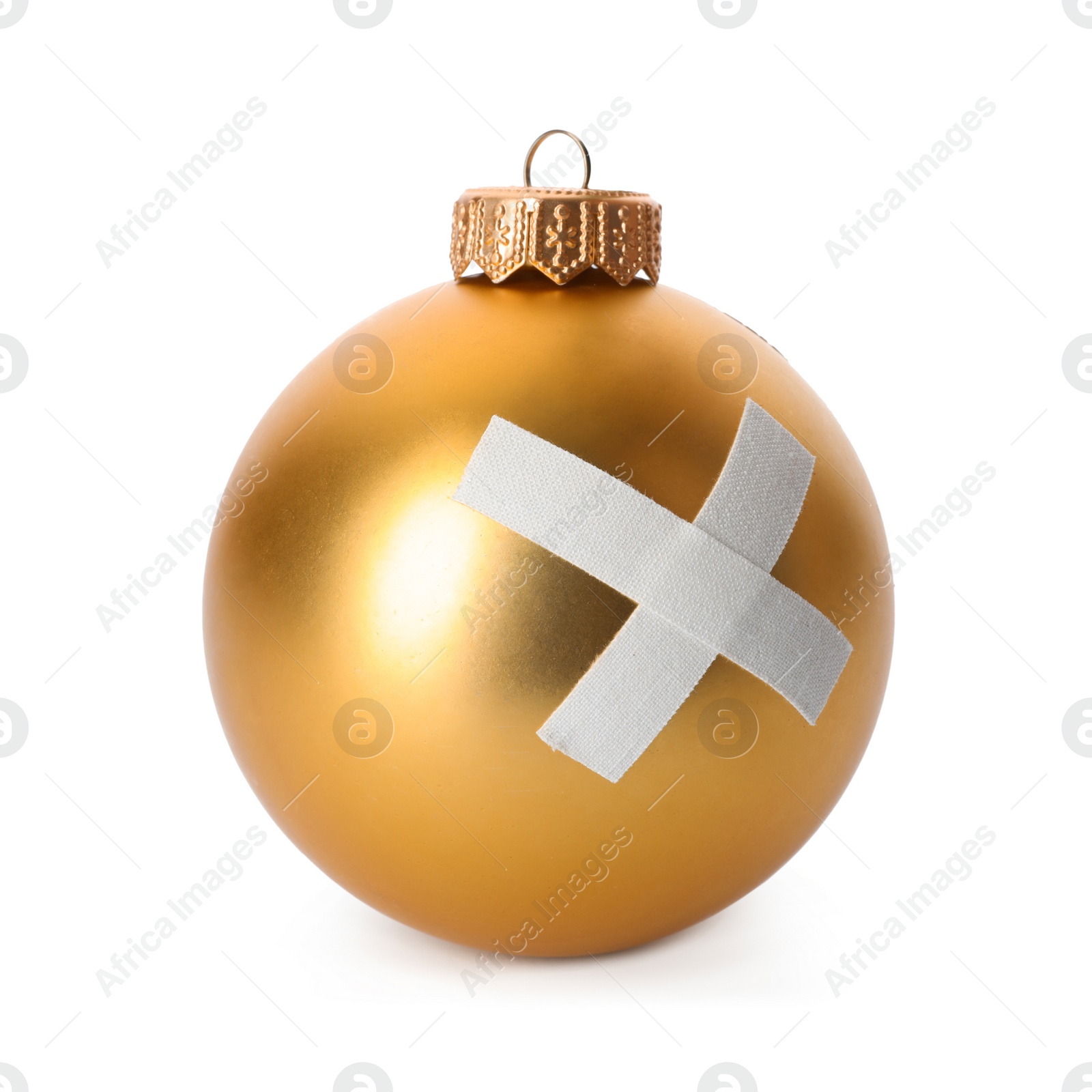 Photo of Shiny gold ball with sticking plasters isolated on white