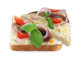 Photo of Delicious sandwiches with anchovy, tomato and basil on white background