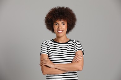 Photo of Portrait of beautiful young woman on grey background