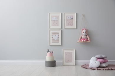 Stylish room interior with beautiful pictures and toys