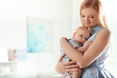 Happy mother and her baby at home