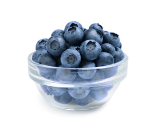 Fresh ripe blueberries in glass bowl on white background