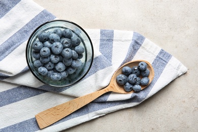 Photo of Flat lay composition with juicy blueberries on color table