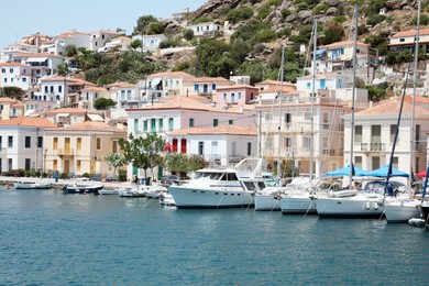 Photo of Beautiful view of coastal city with boats on sunny day