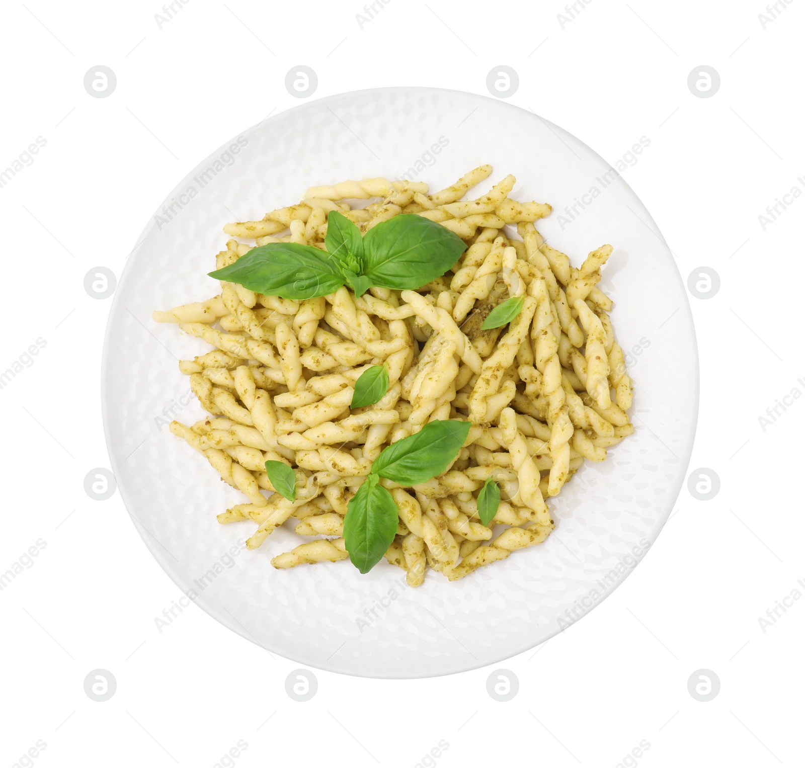 Photo of Plate of delicious trofie pasta with pesto sauce and basil leaves isolated on white, top view
