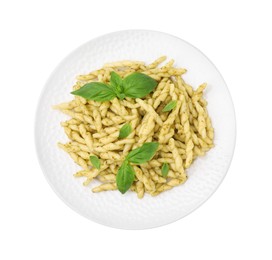 Plate of delicious trofie pasta with pesto sauce and basil leaves isolated on white, top view