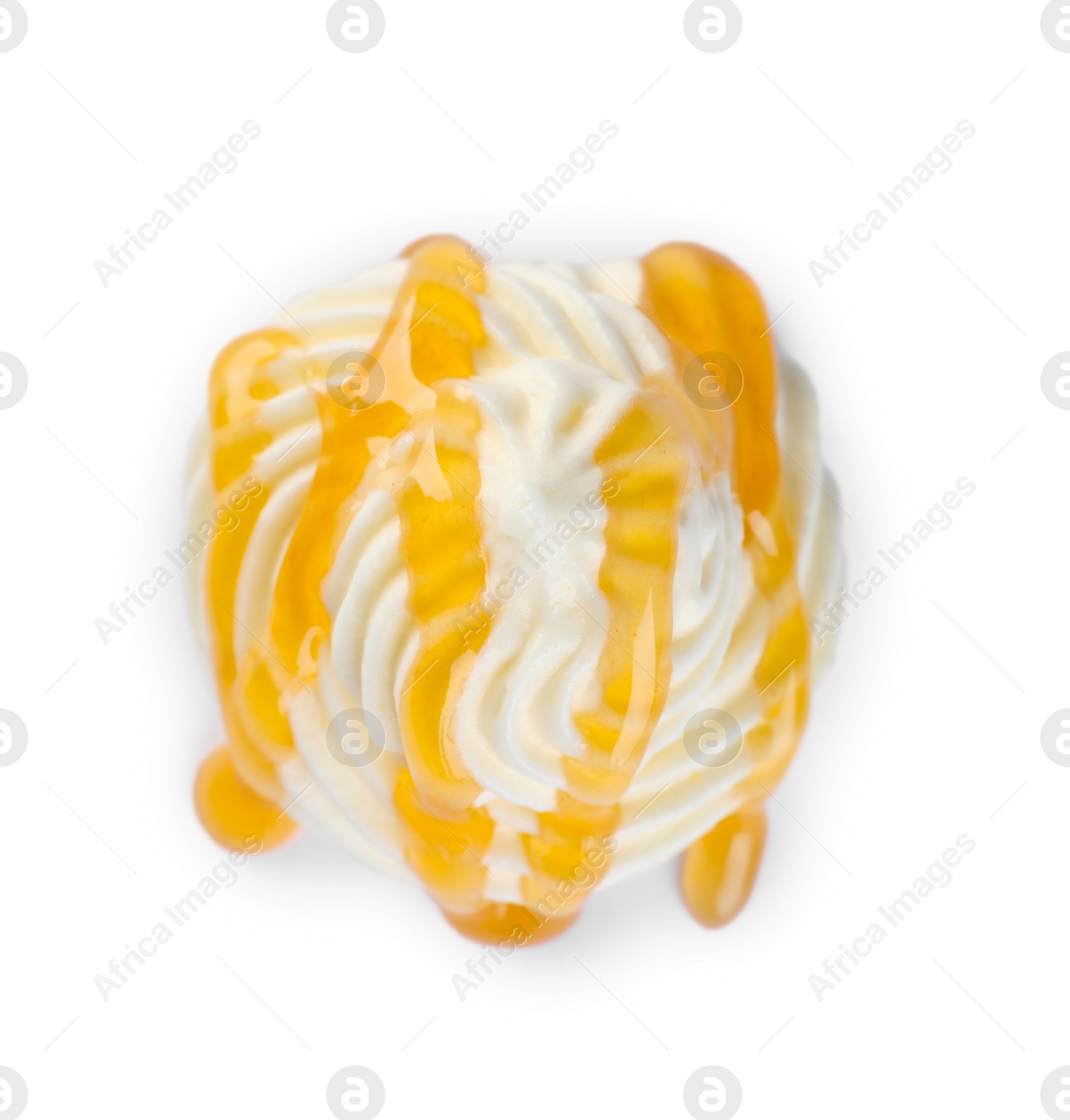 Photo of Delicious fresh whipped cream with caramel sauce isolated on white, top view