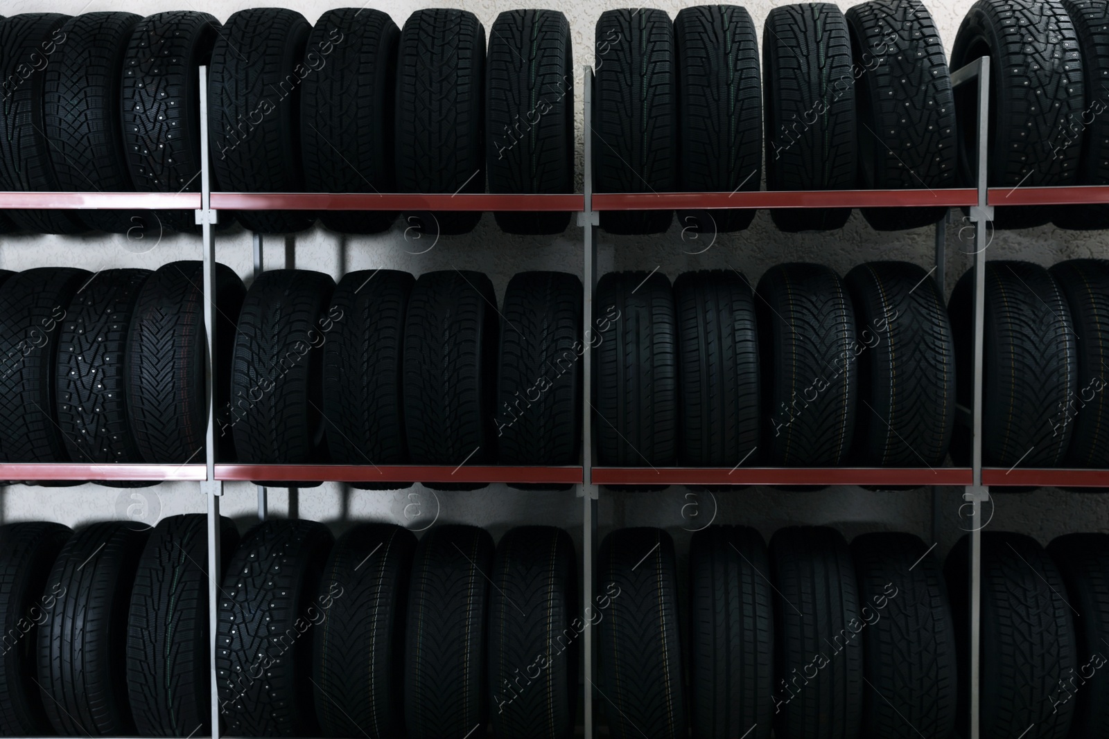 Photo of Car tires on rack in auto store