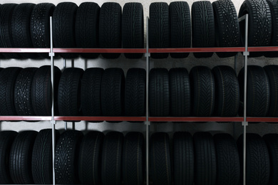 Car tires on rack in auto store