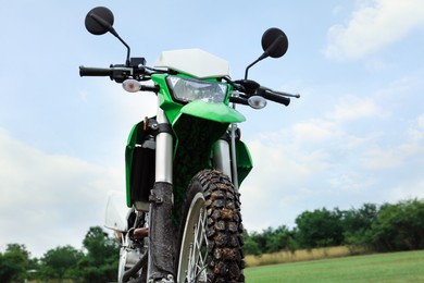 Photo of Stylish cross motorcycle outdoors, low angle view