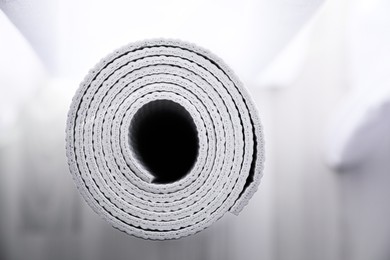 Photo of Rolled karemat or fitness mat, closeup view