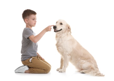 Cute little child with his pet on white background