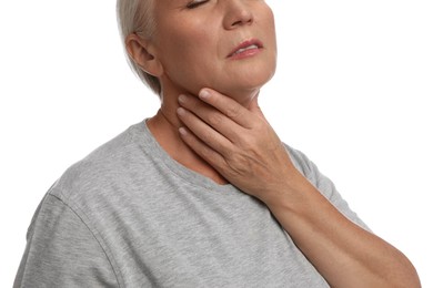 Photo of Mature woman doing thyroid self examination on white background, closeup