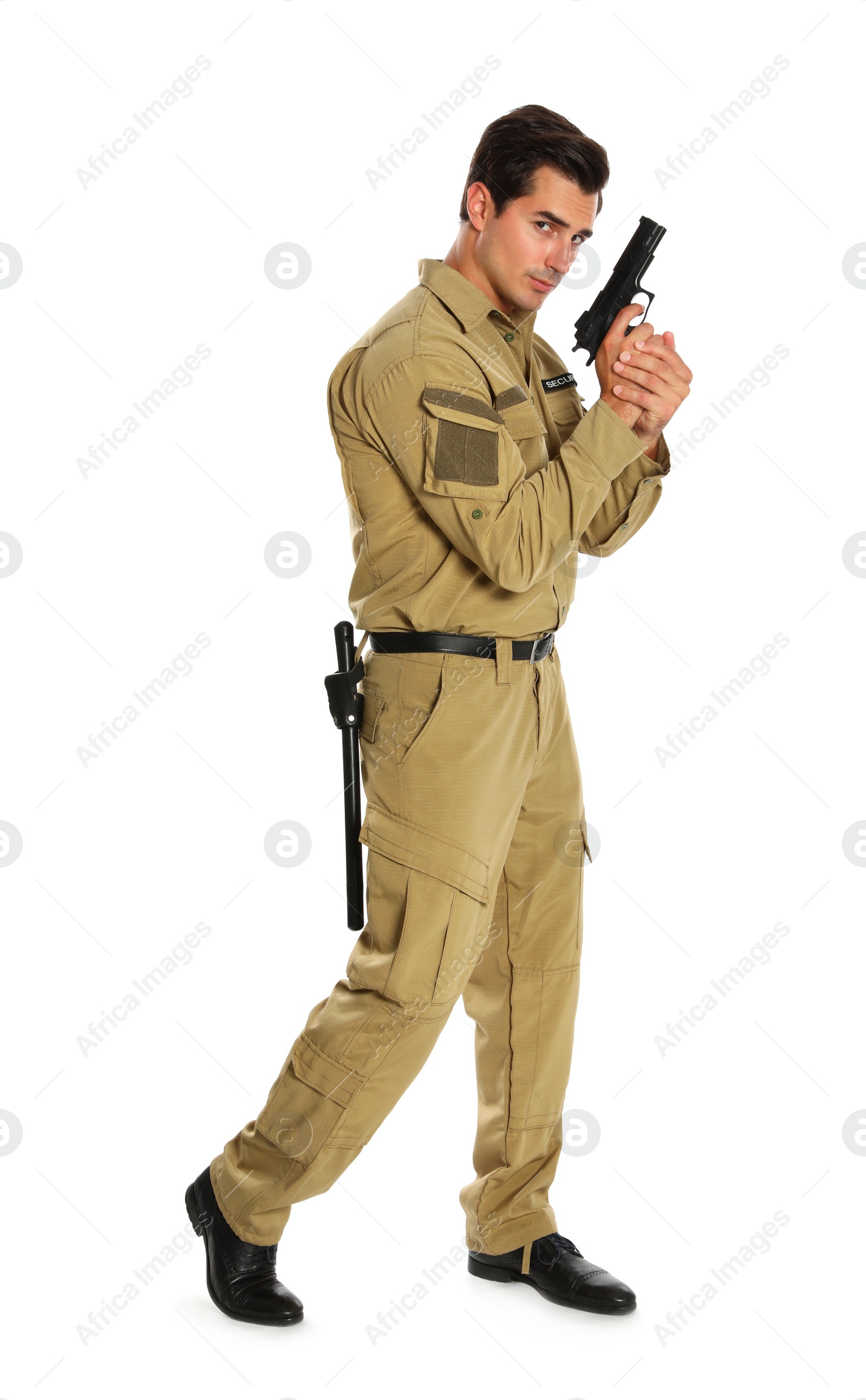 Photo of Male security guard in uniform with gun on white background