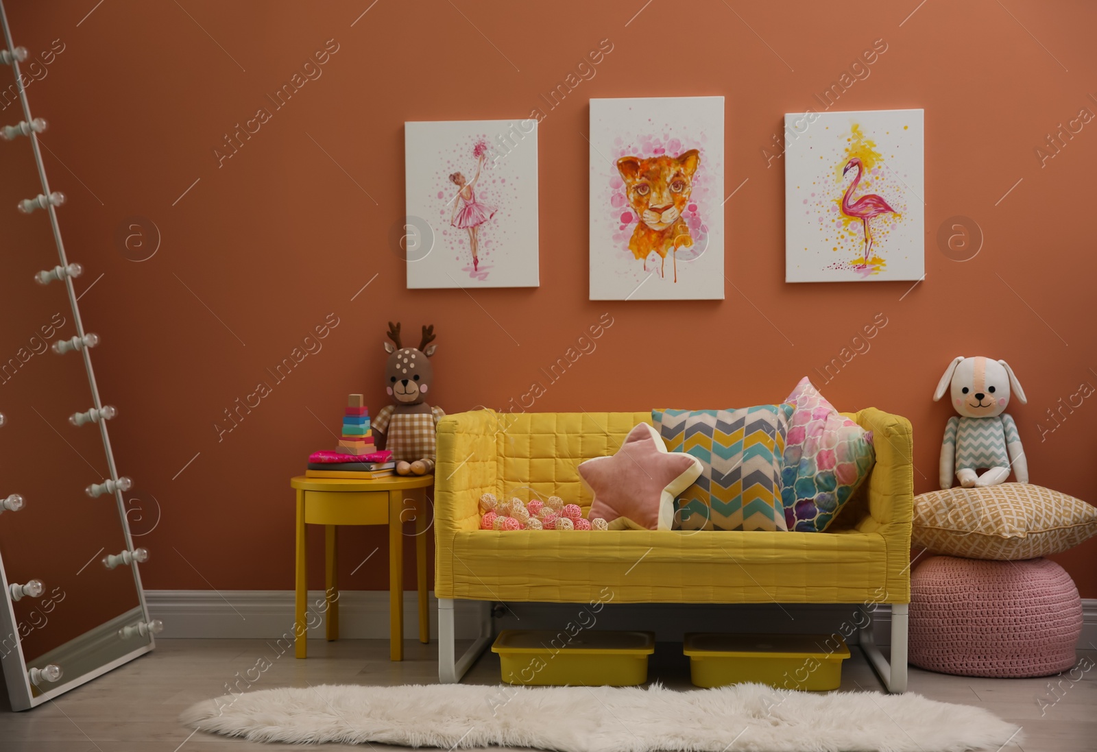 Photo of Cute pictures and comfortable sofa  in baby room interior