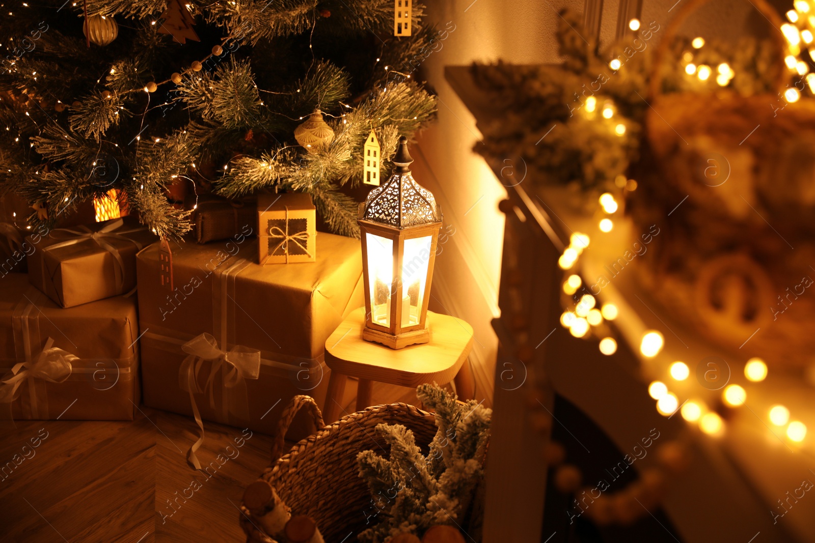 Photo of Christmas tree and gifts in beautiful room interior