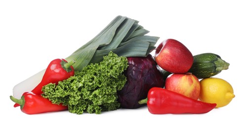 Heap of fresh ripe vegetables and fruits on white background