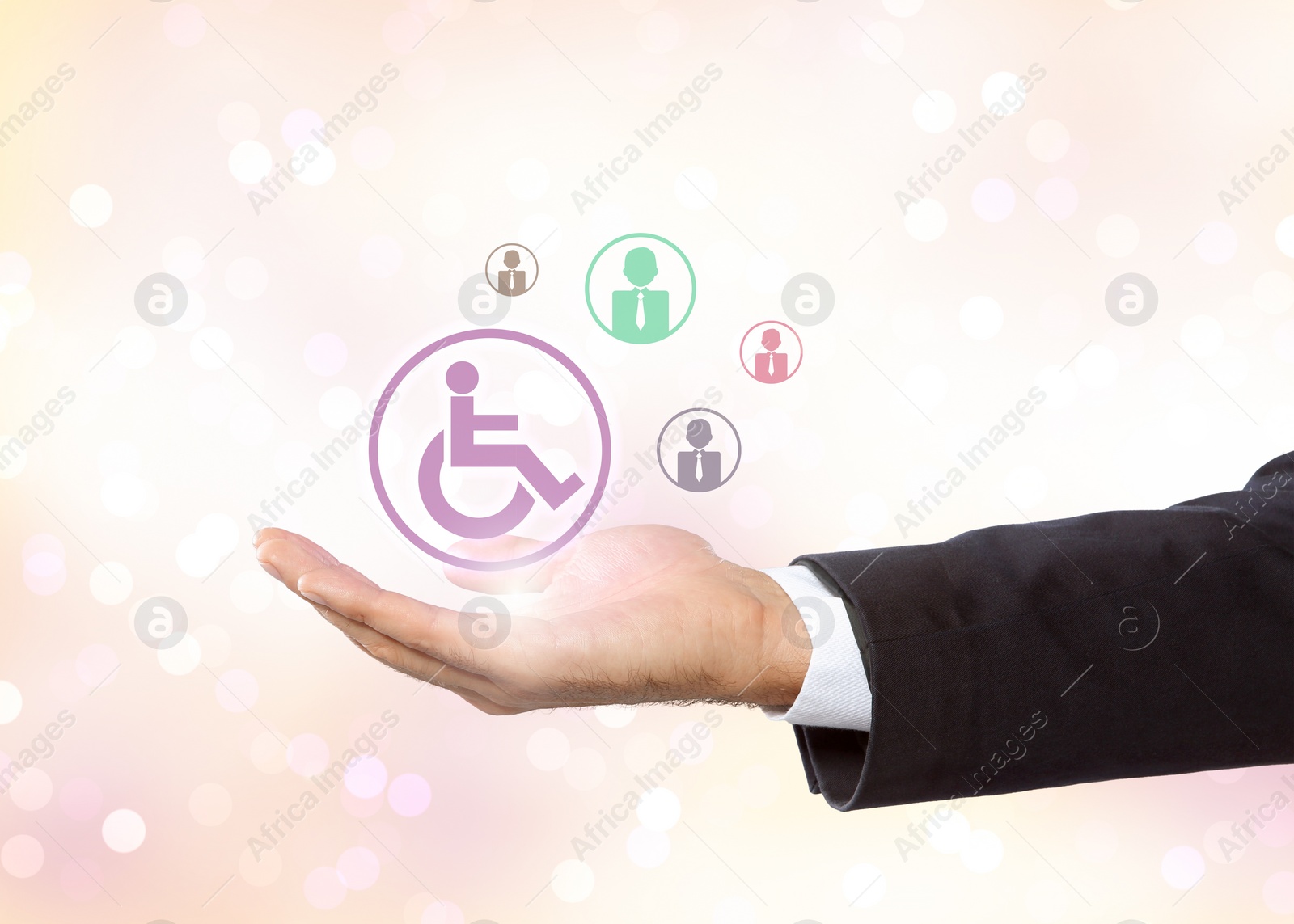 Image of Inclusive workplace culture. Businessman holding international symbol of access and employee icons on light background, closeup