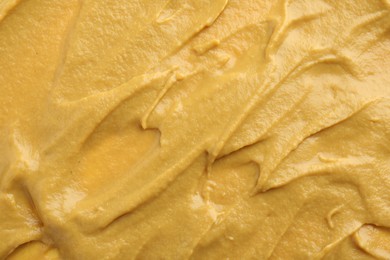 Fresh tasty mustard sauce as background, top view