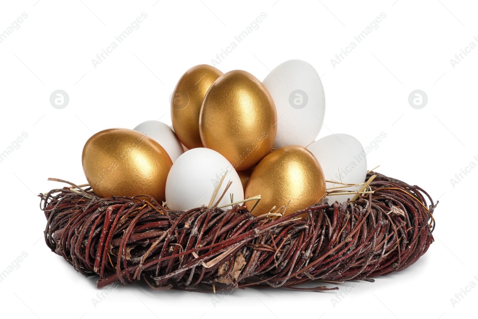 Photo of Nest with golden eggs among ordinary ones on white background