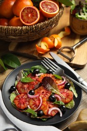 Photo of Delicious sicilian orange salad served on wooden table