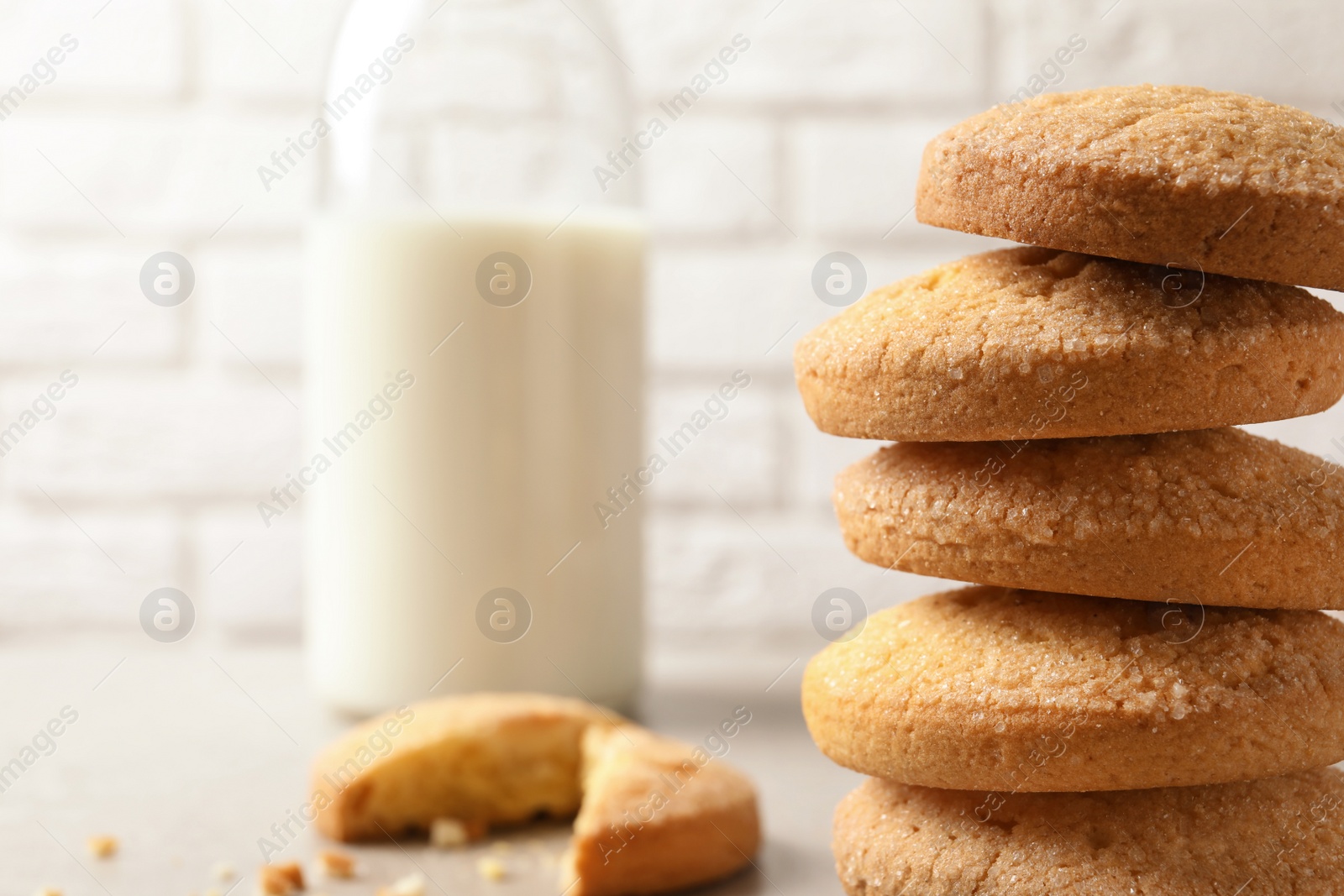 Photo of Stack of Danish butter cookies on blurred background. Space for text