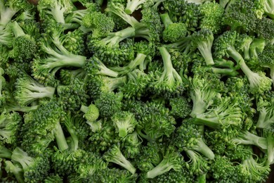 Fresh raw broccoli as background, top view