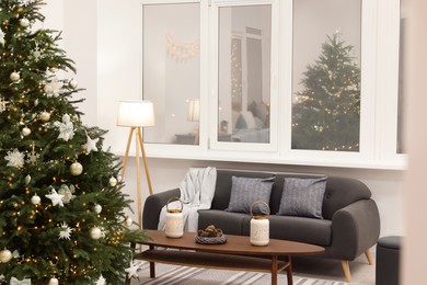 Beautiful Christmas tree and decor in living room. Interior design