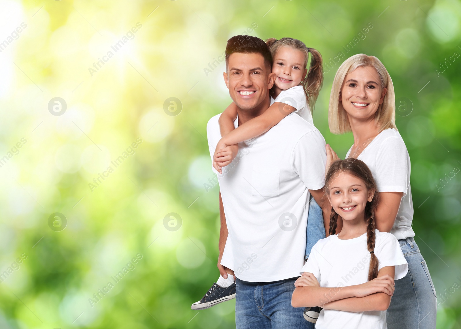 Image of Happy family with children outdoors on sunny day, space for text