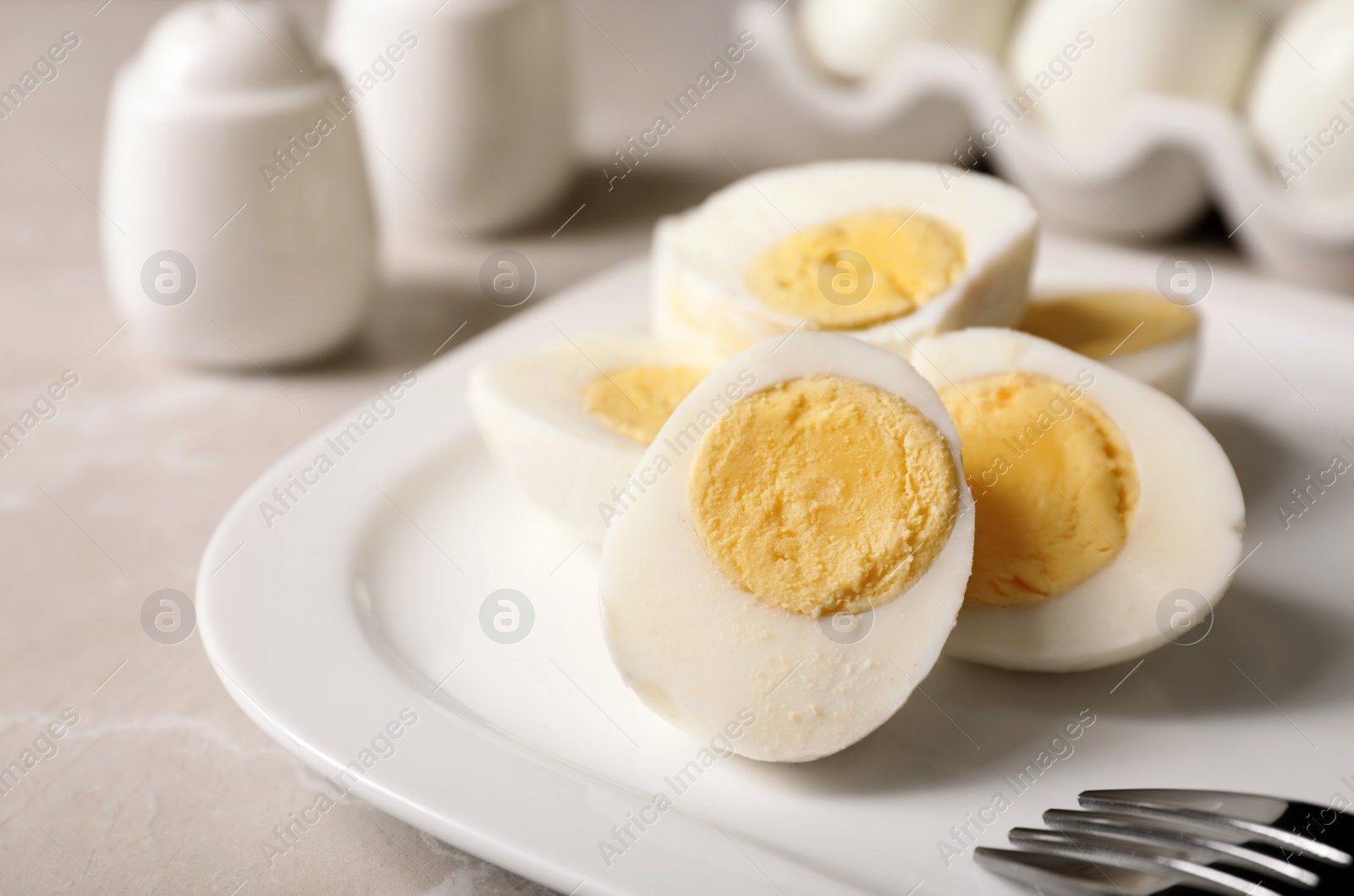 Photo of Plate with hard boiled eggs on table