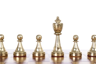 Photo of King among pawns on wooden chess board against white background