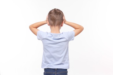 Photo of Dyslexia problem. Boy covering head with hands on white background, back view