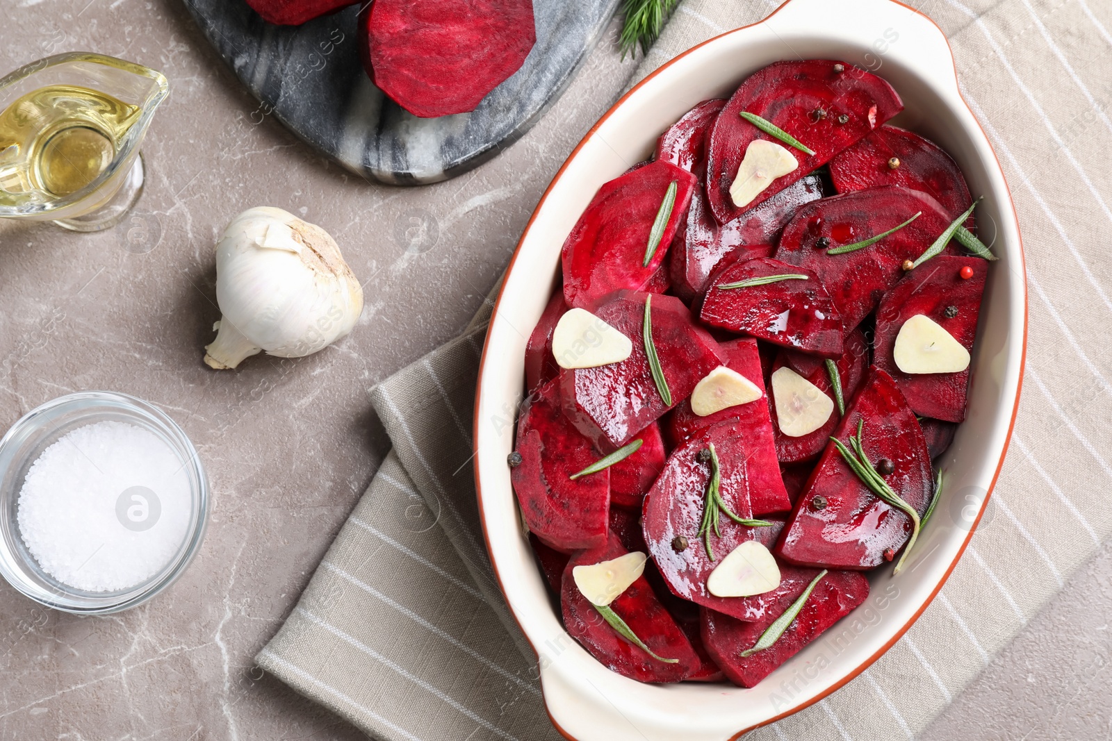 Photo of Flat lay composition with raw beetroot slices on marble table