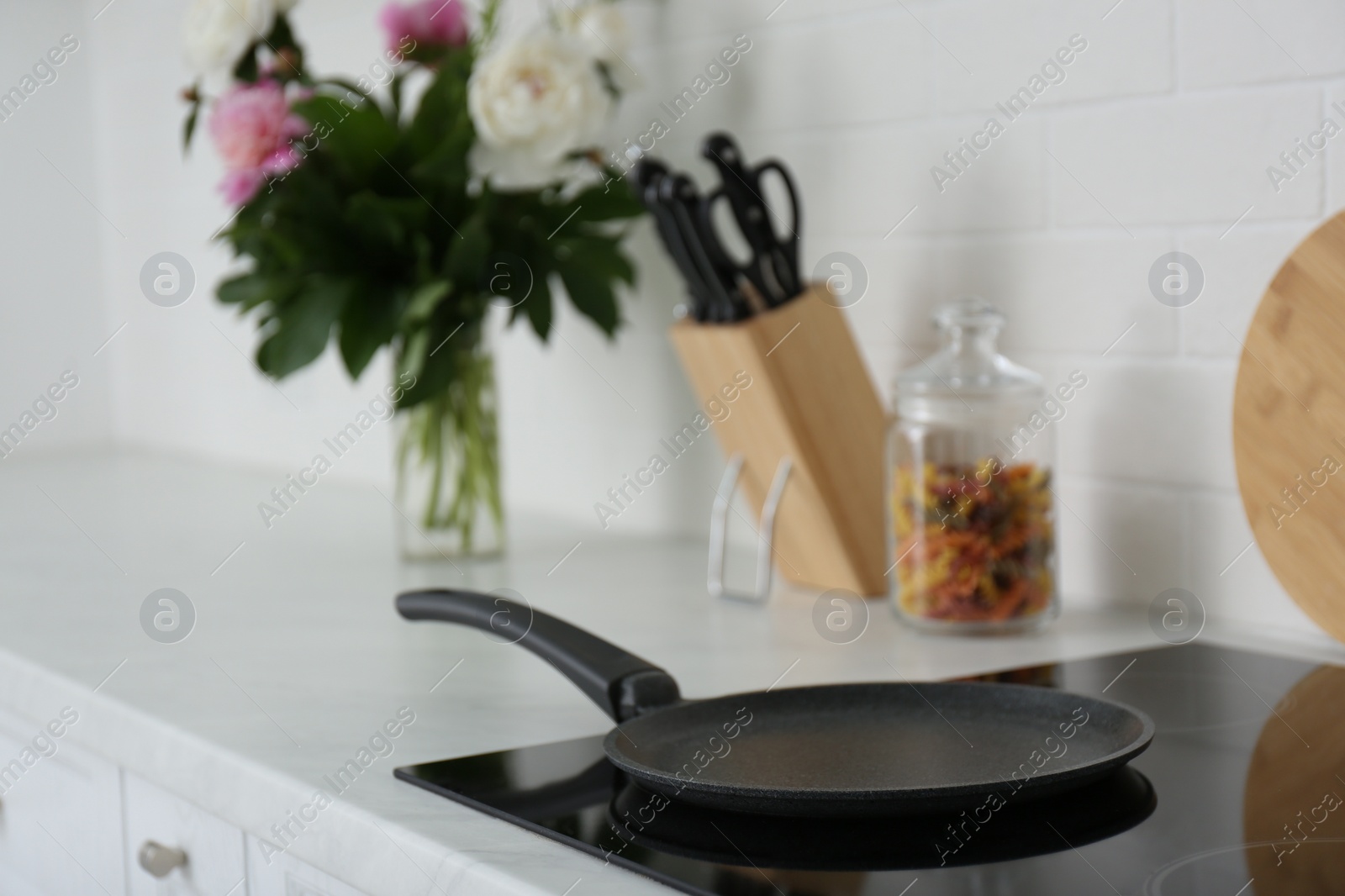 Photo of Crepe pan on induction stove in kitchen