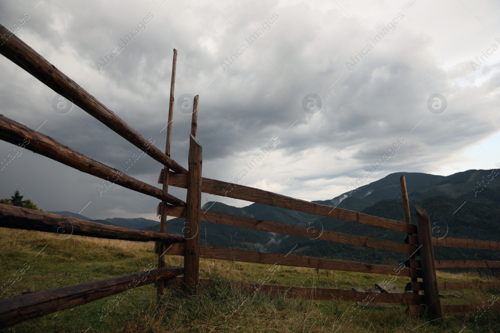 Photo of Beautiful view of mountain countryside with wooden fence