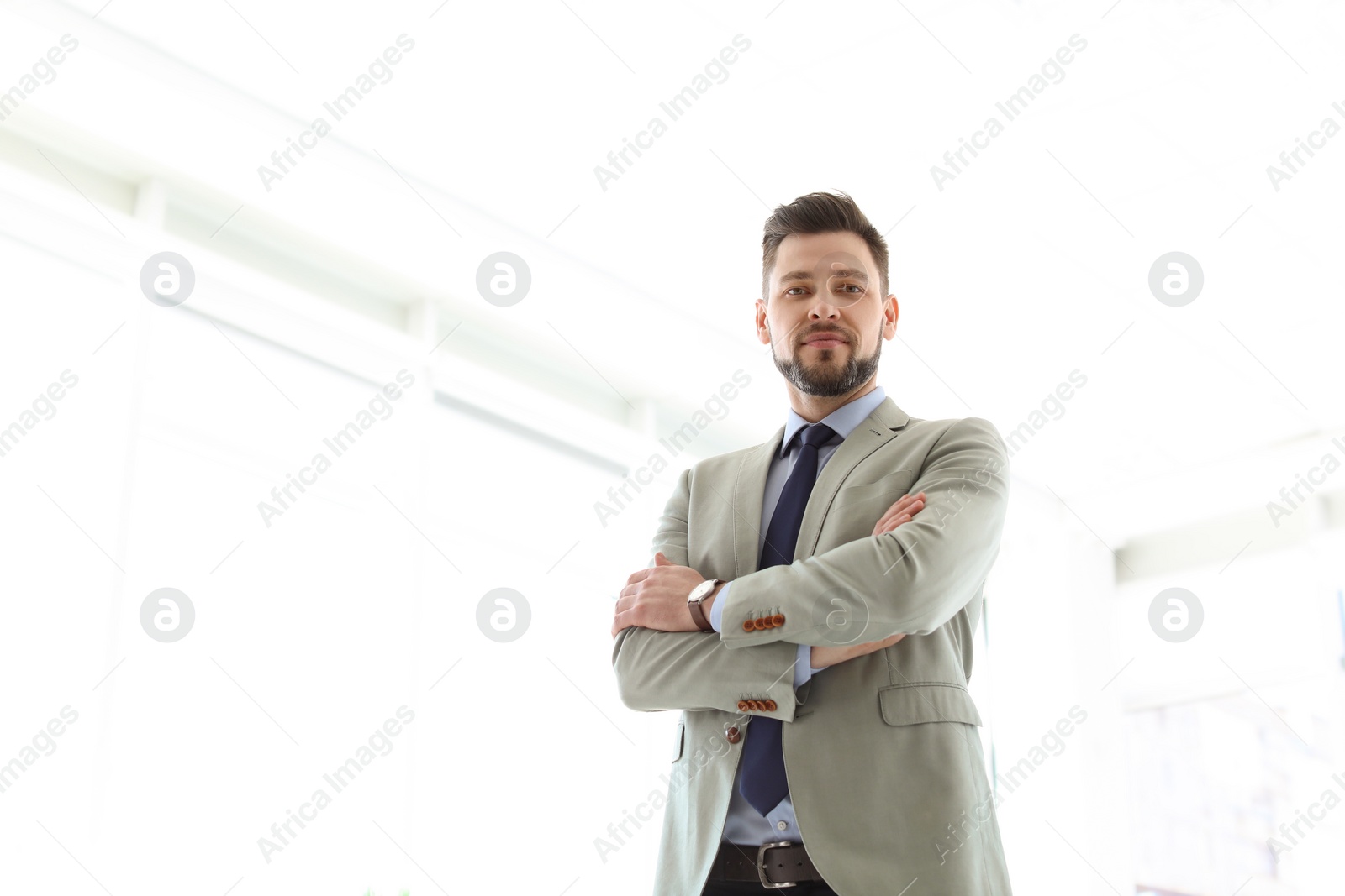 Photo of Male lawyer standing in light office
